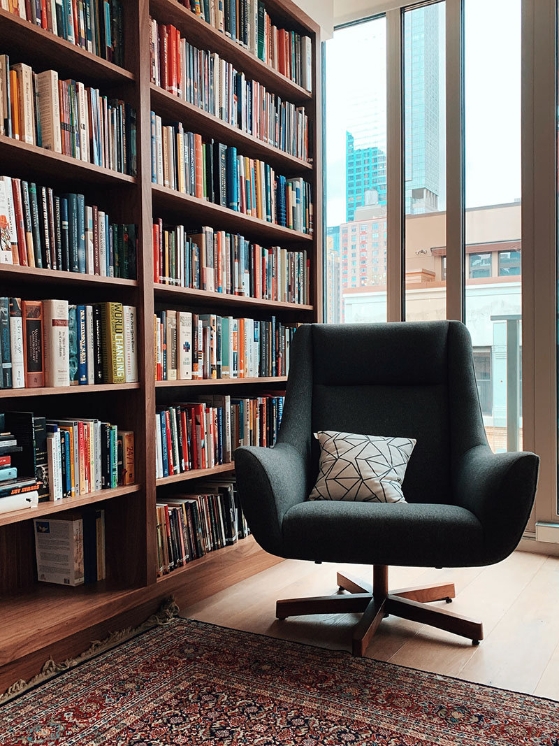 Photo of library with comfortable chair